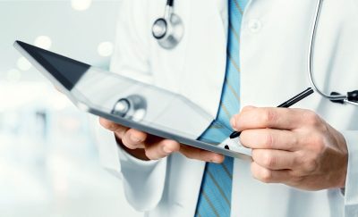 doctor-with-tablet-cropped_513892576-1200 doctor-with-tablet-cropped_513892576-1200