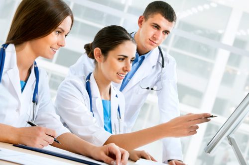 three-doctors-looking-computer-screen_85829212 three-doctors-looking-computer-screen_85829212